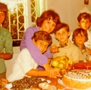 Naifeh embracing Ali as he cuts a cake on his birthday