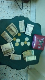 Ahmad's money bag shown with old Lebanese currency
